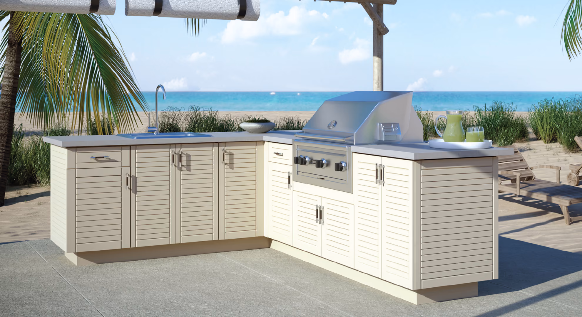 Outdoor kitchen with white Endura cabinets and a built-in grill on a beachfront patio