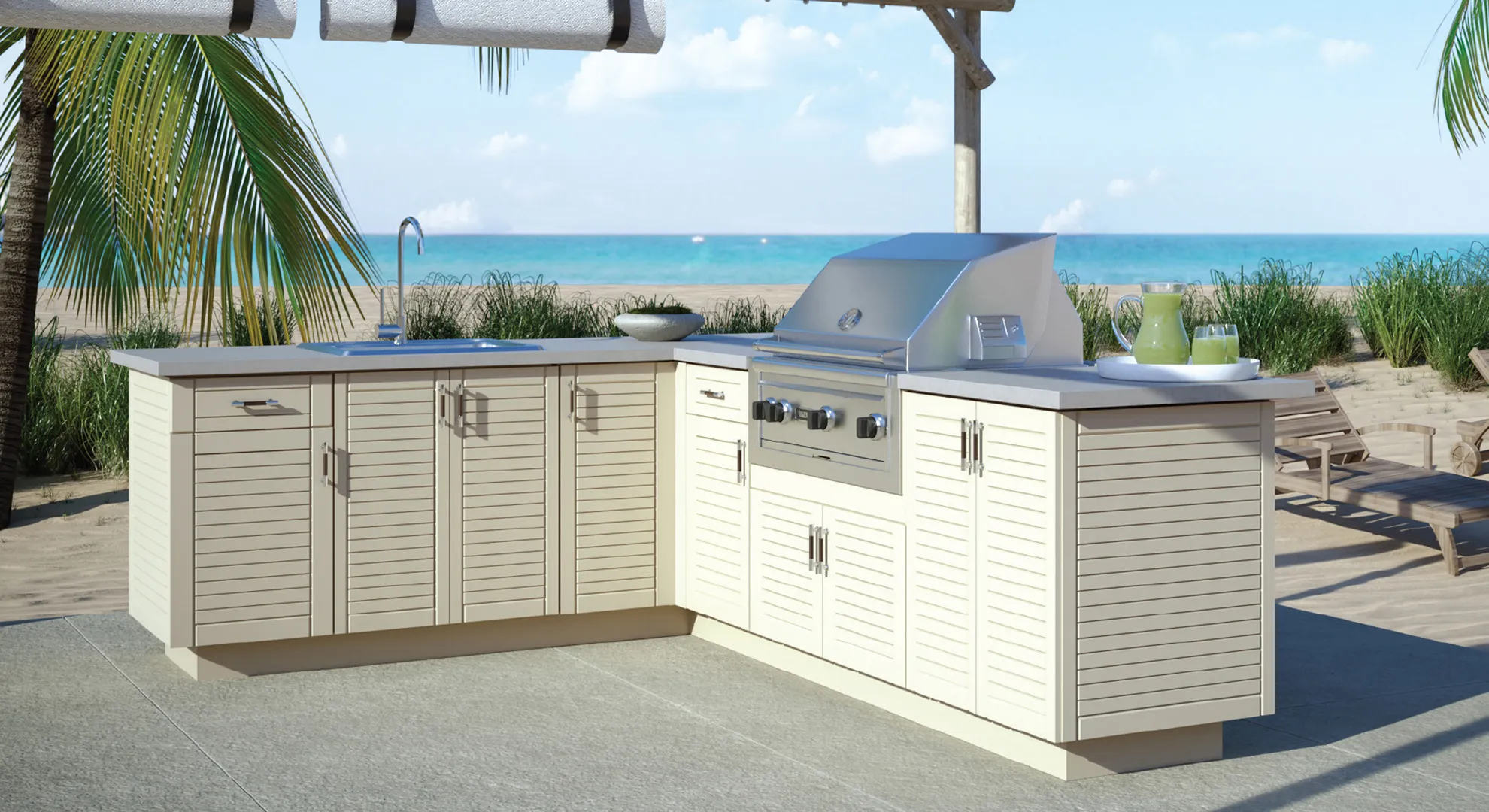 Outdoor kitchen with white Endura cabinets and a built-in grill on a beachfront patio