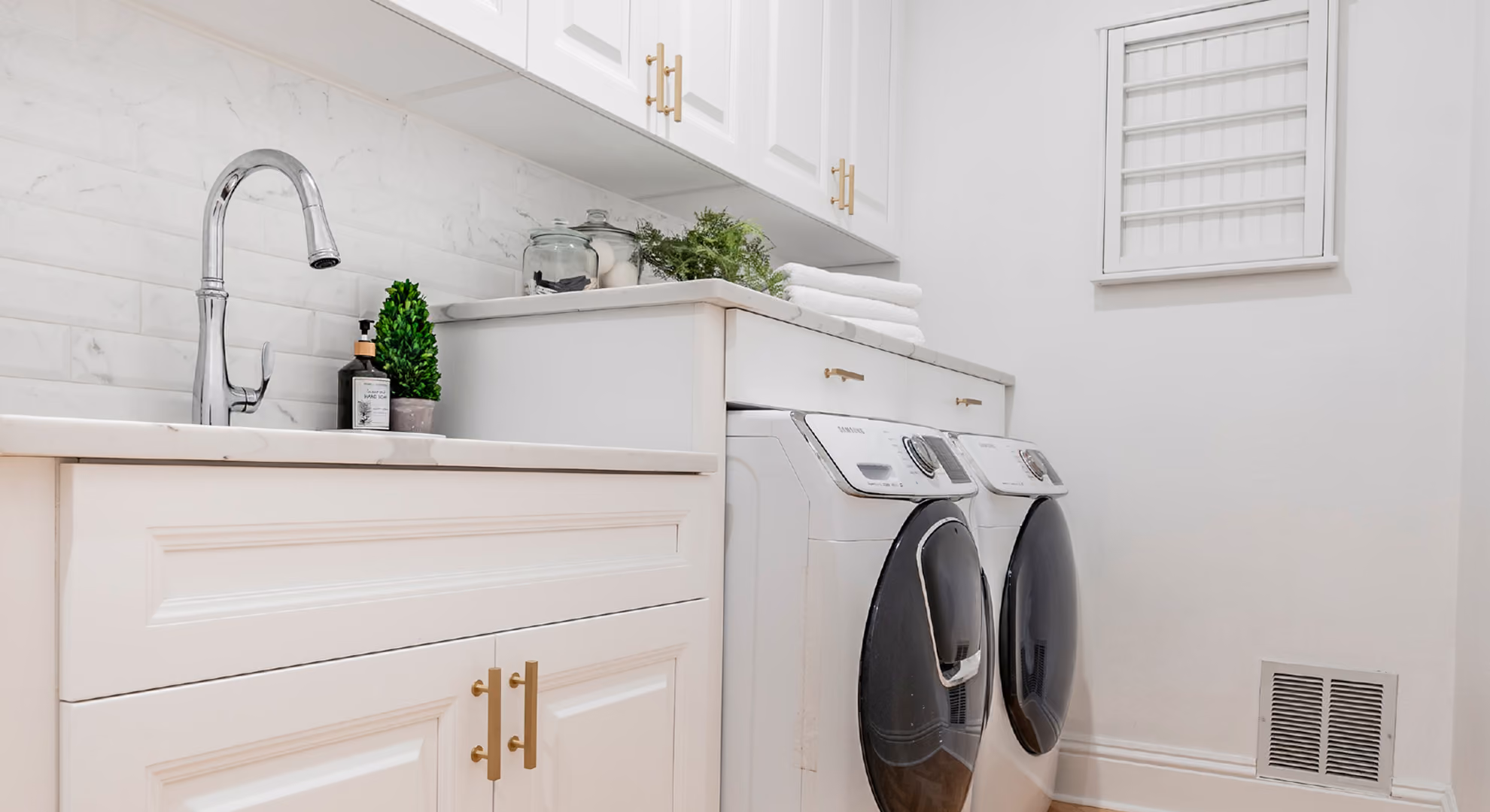 Laundry room: white raised-panel with washer and dryer
