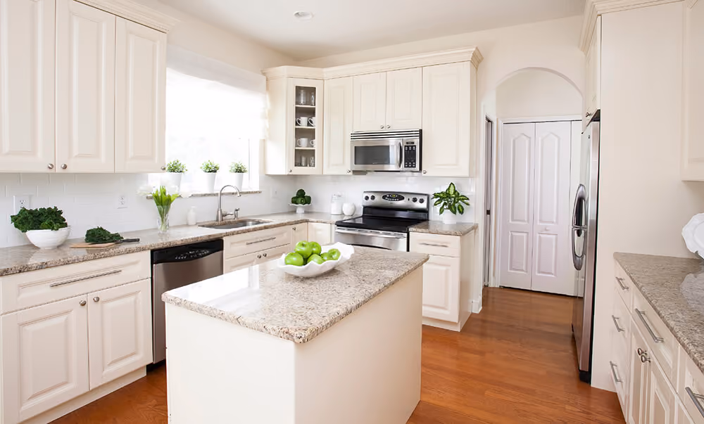 Kitchen: cream raised-panel with island