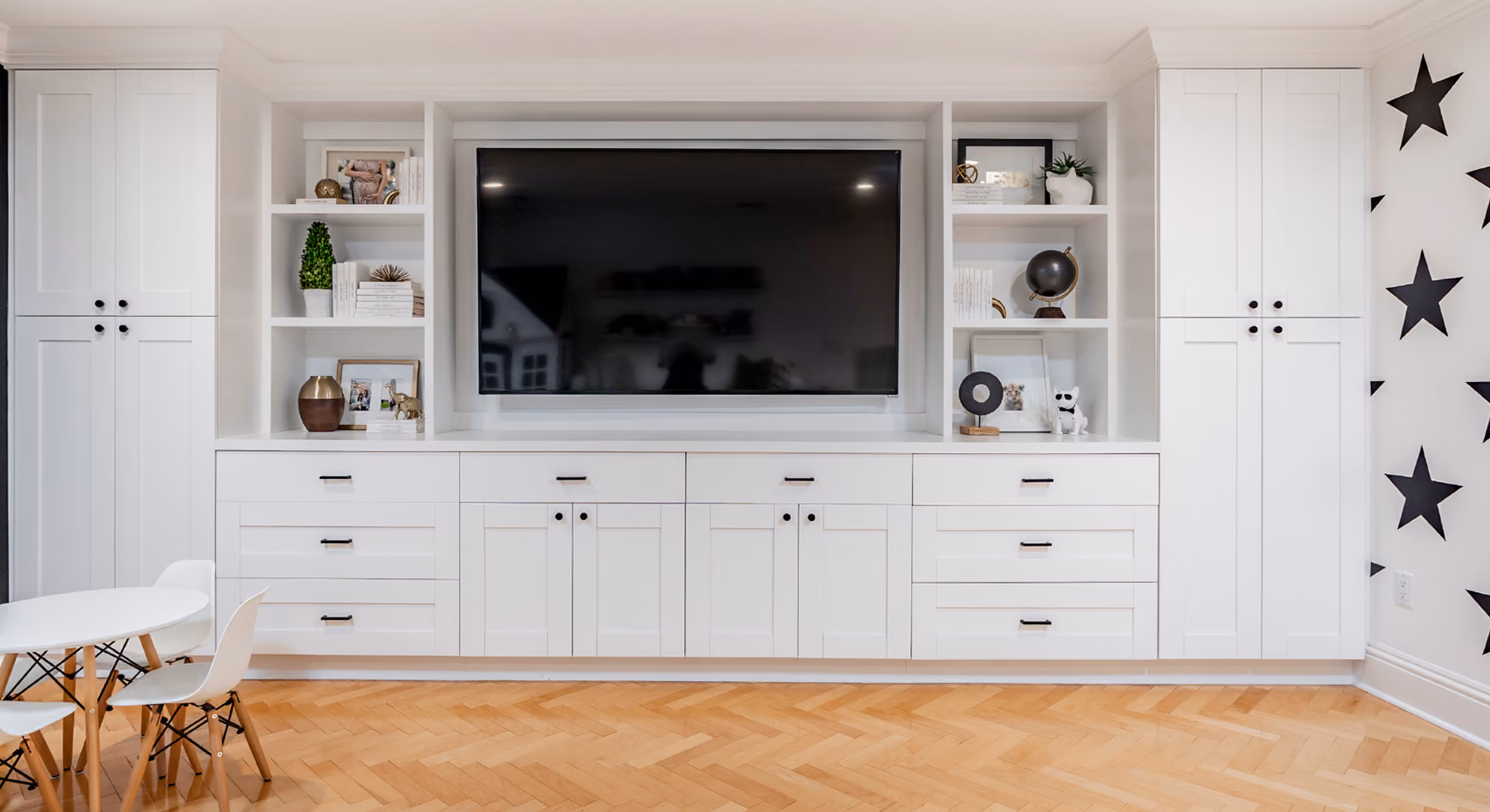 Living room built-in: white shaker media wall with TV