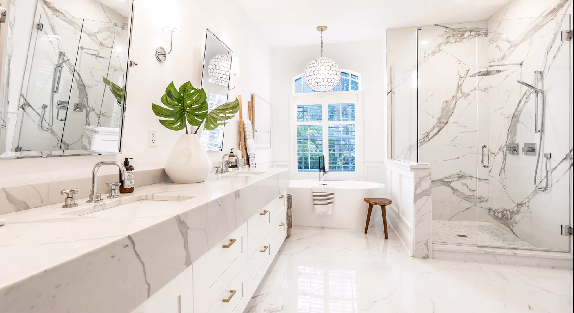 Bath: white vanity with marble shower surround