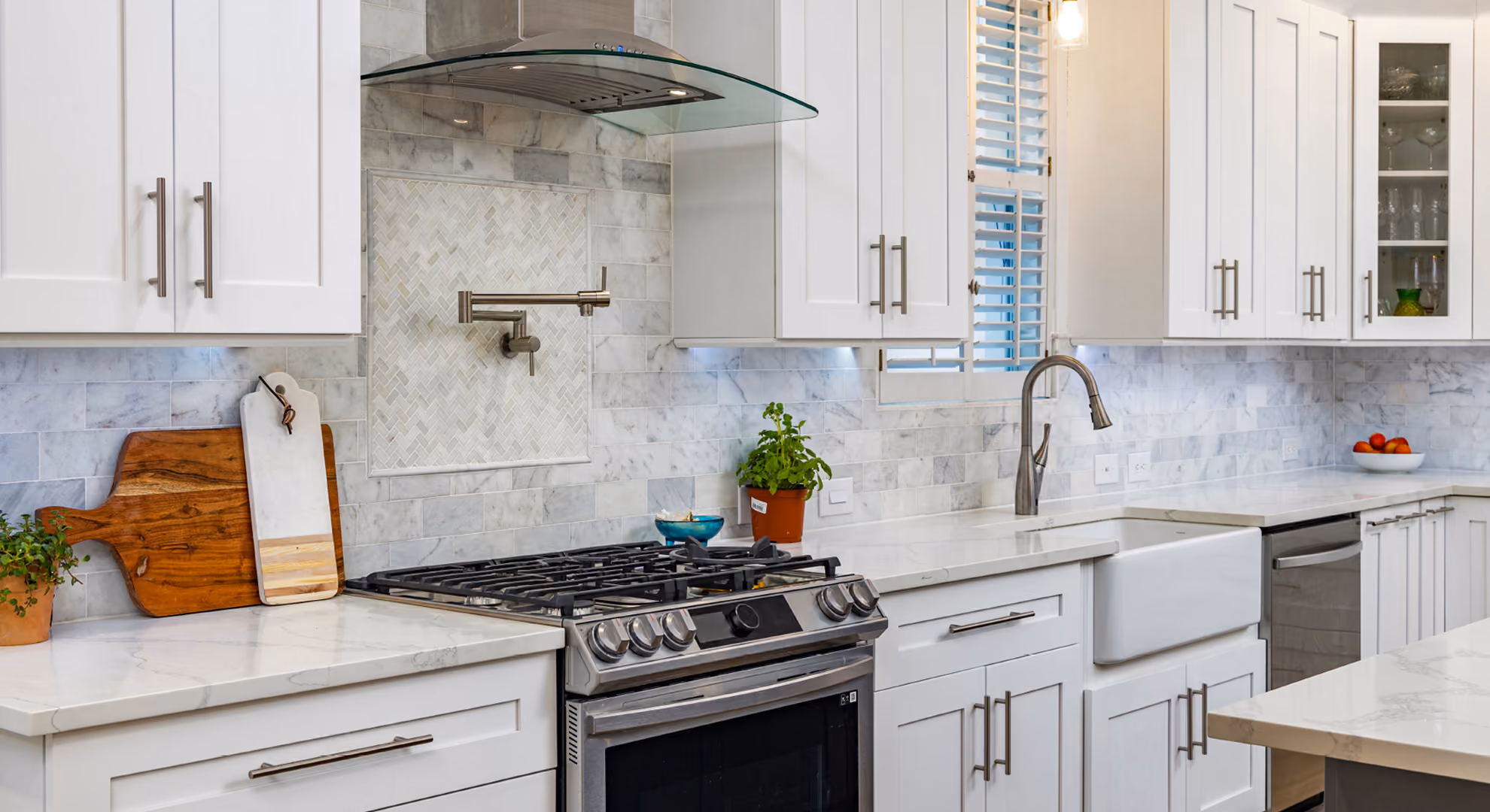Kitchen: white shaker with marble backsplash, range