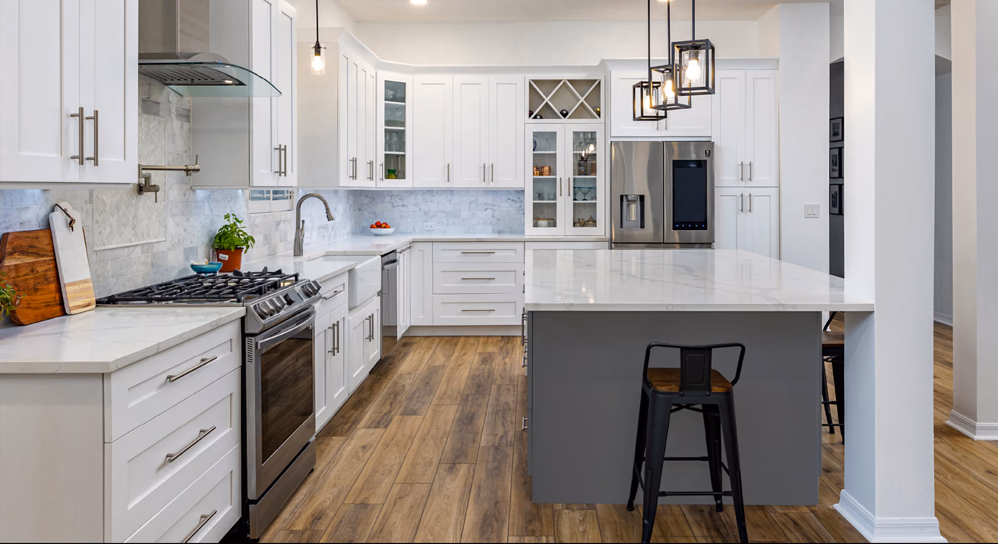 Storm Gray kitchen: white with gray island, bar stool, wood floor