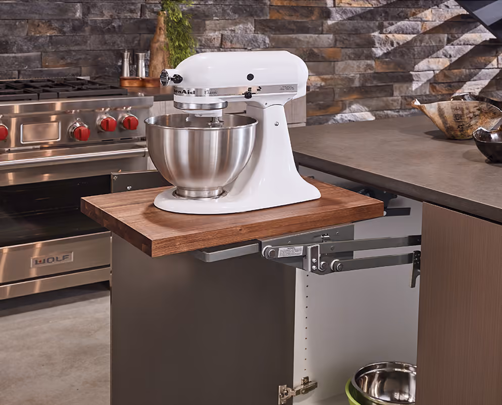 Mixer lift raising a stand mixer to counter height